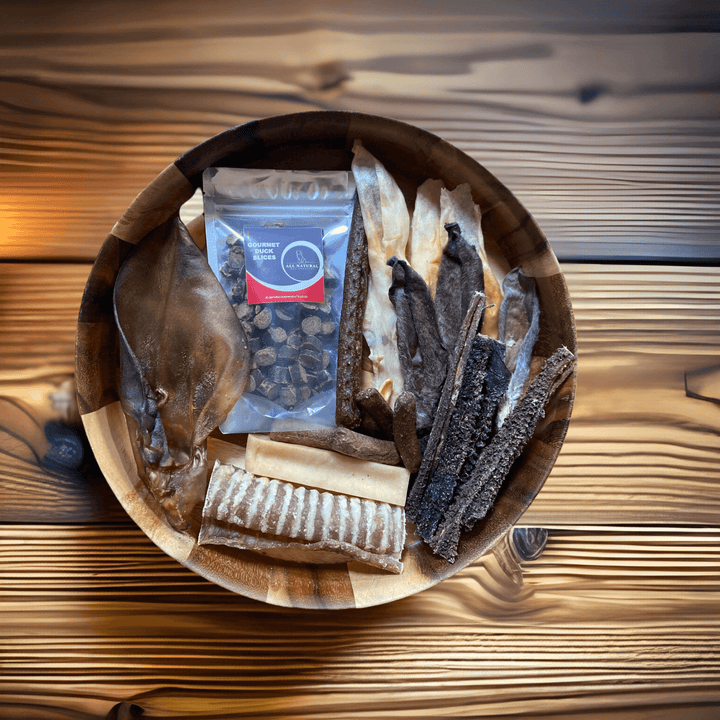 Dim Gray Puppy treat box with training treats.